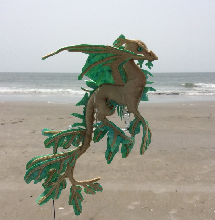 Velvet dragon sculpture on the seashore